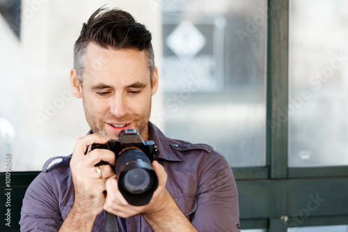 Male photographer taking picture