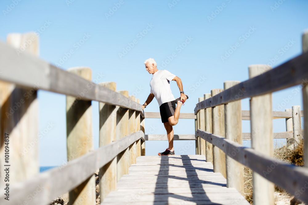 Man training on beach outside