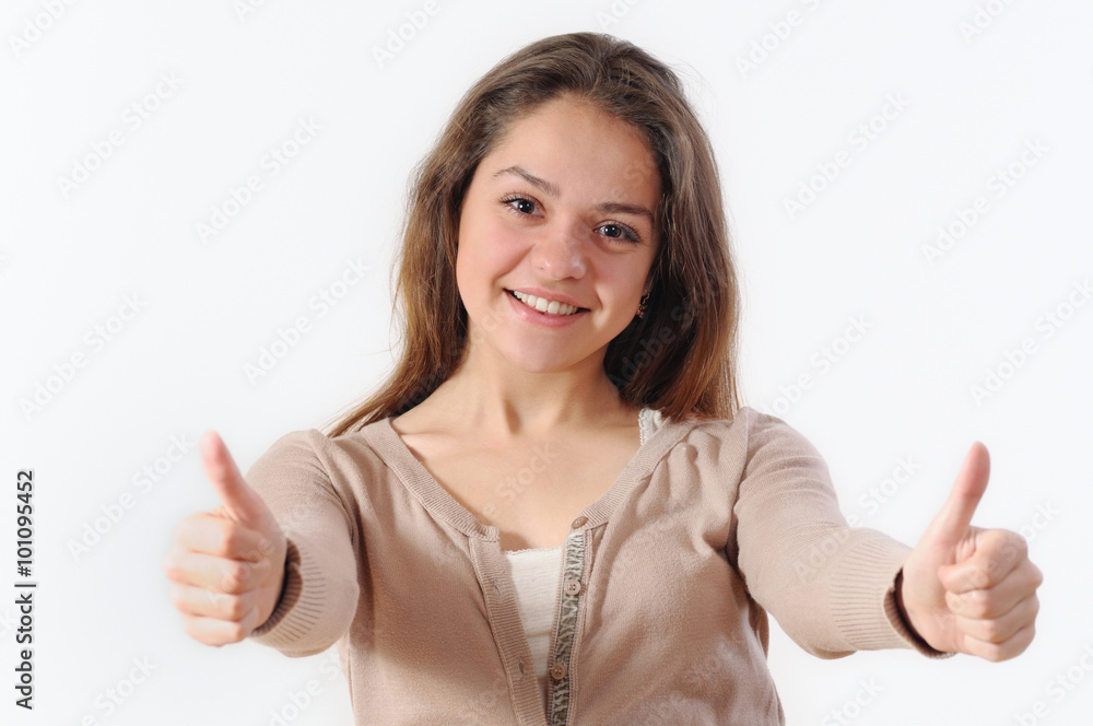 portrait of a beautiful young woman smiling and holding thumbs u portrait of a beautiful young woman smiling and holding thumbs u