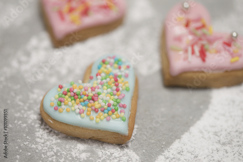 Baked valentine's heart covered with blue icing and confetti