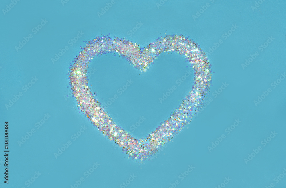 Abstract heart of white glitter sparkle on blue background