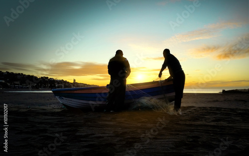 Two men preparing to go fishing