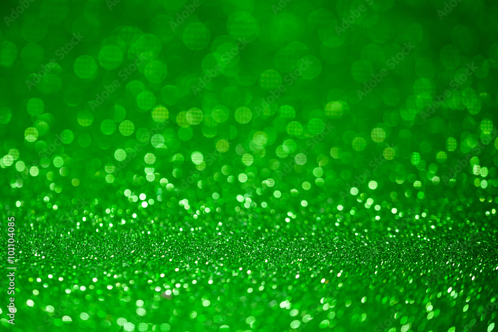 Green glitter surface with green light bokeh - It can be used for background for special occasions promotion campaign or product display Green glitter surface with green light bokeh - It can be used for background for special occasions promotion campaign or product display
