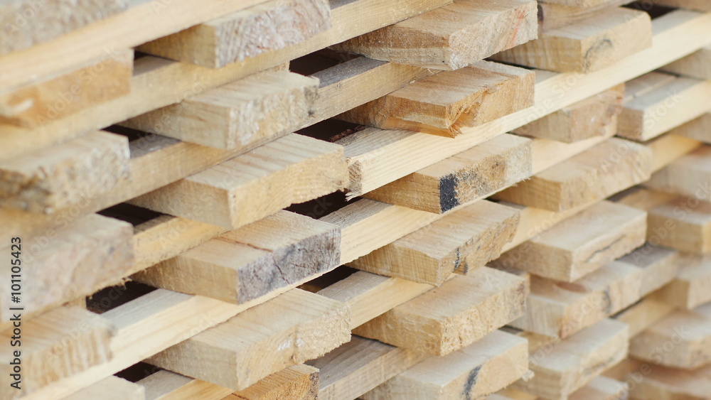 Planks of wood stacked neatly on the shelves in the hardware store. Planks of wood stacked neatly on the shelves in the hardware store.