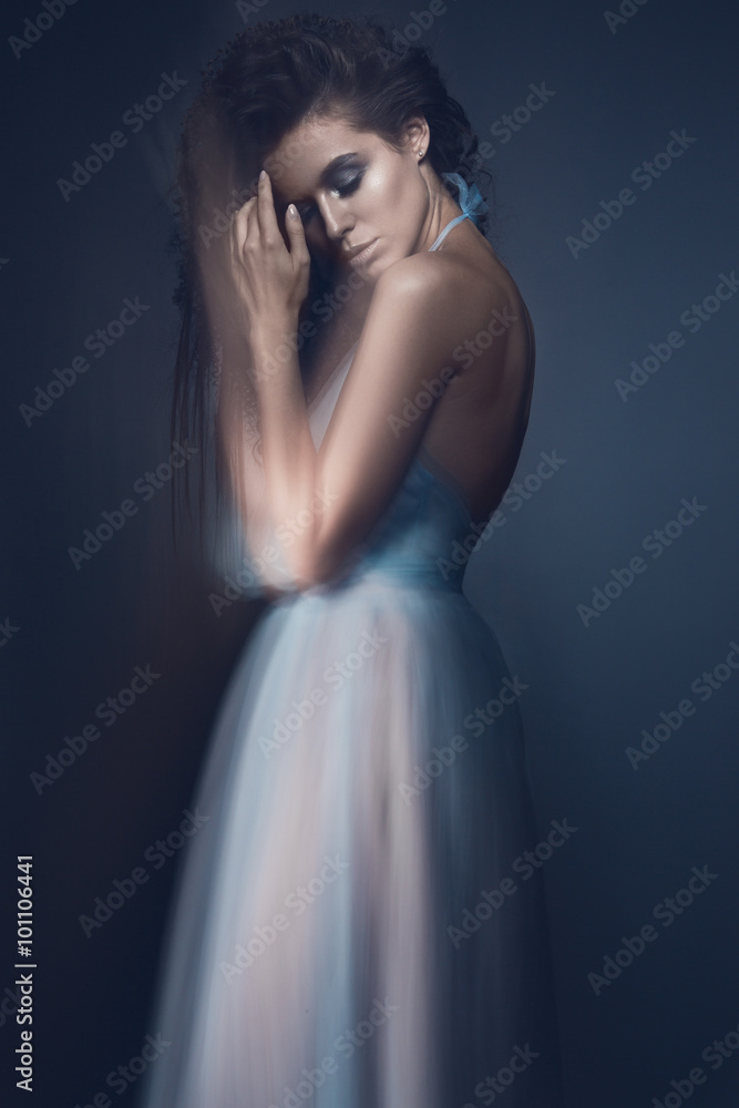 Beautiful girl in light blue dress and long hair, fashionable image. Beauty fashion style. 