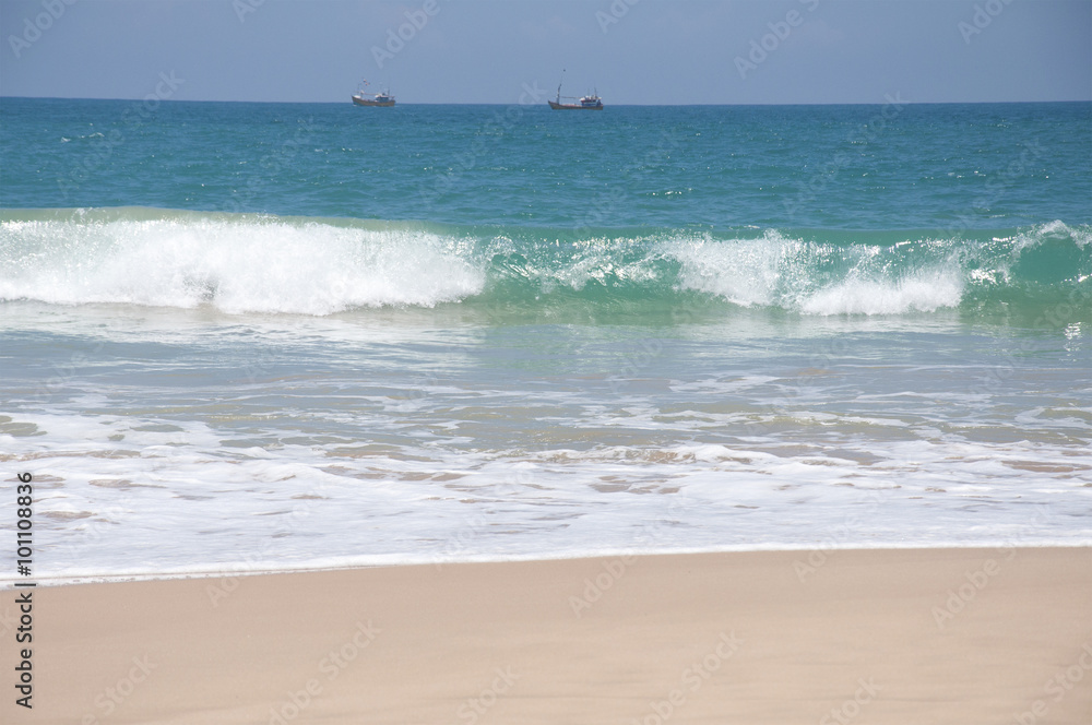 Boats sailing in the clear blue waters of the Indian Ocean on a bright sunny day in Sri Lanka Boats sailing in the clear blue waters of the Indian Ocean on a bright sunny day in Sri Lanka