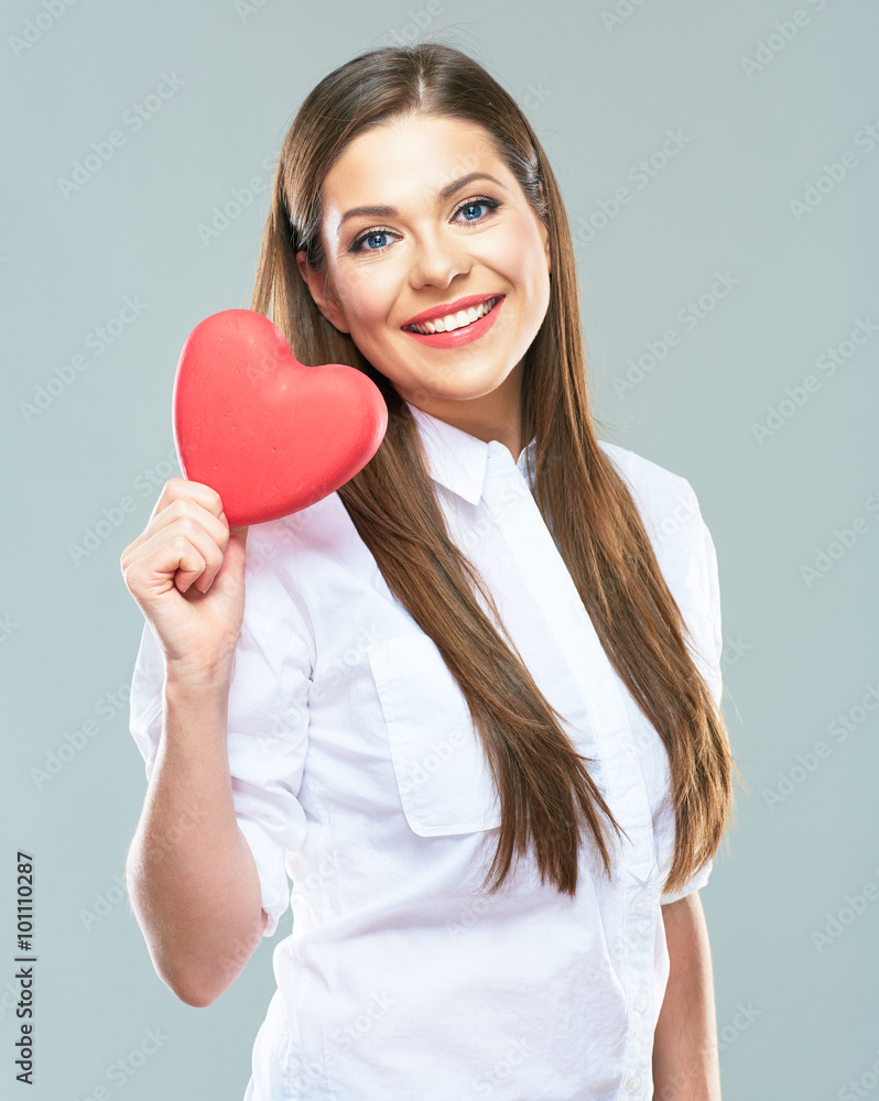 Beautiful toothy smiling woman hold red heart. Beautiful toothy smiling woman hold red heart.