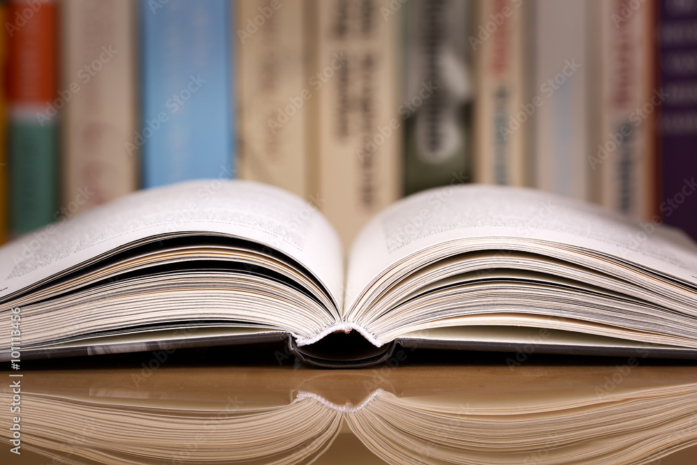 Fototapeta premium Open book in library or bookstore