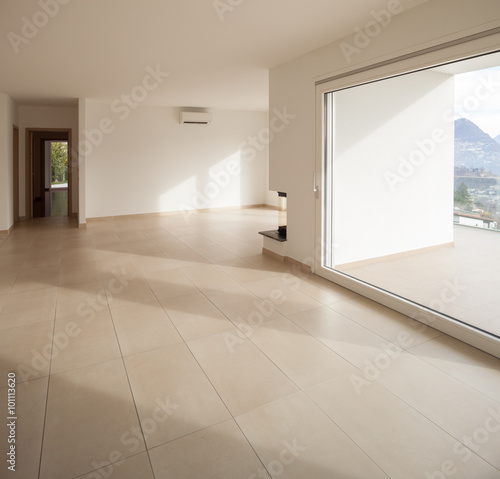 interior of new apartment  empty living room  tiled floor
