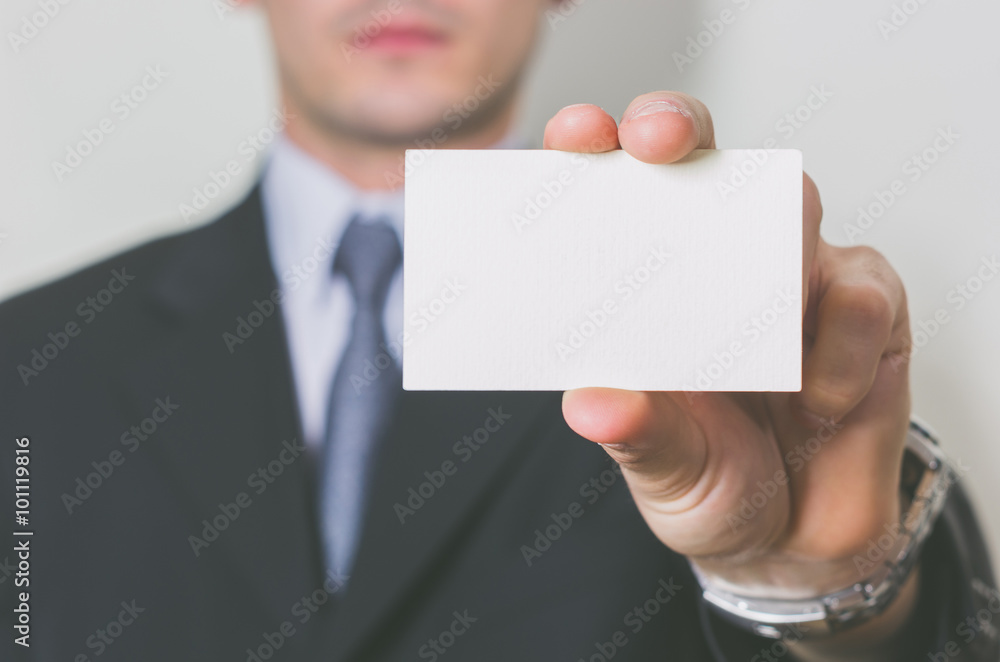 business man showing his business card on a white background - people, business and lifesyle concept business man showing his business card on a white background - people, business and lifesyle concept