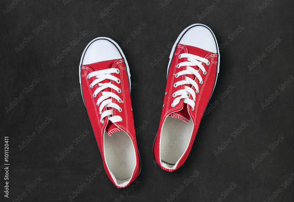 red shoes on black background with space for text