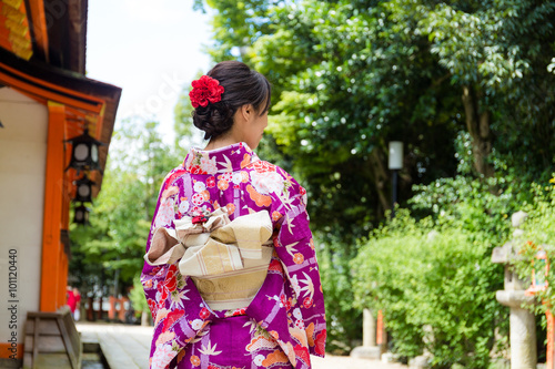 The back view of Young Woman wearing the kimono dress