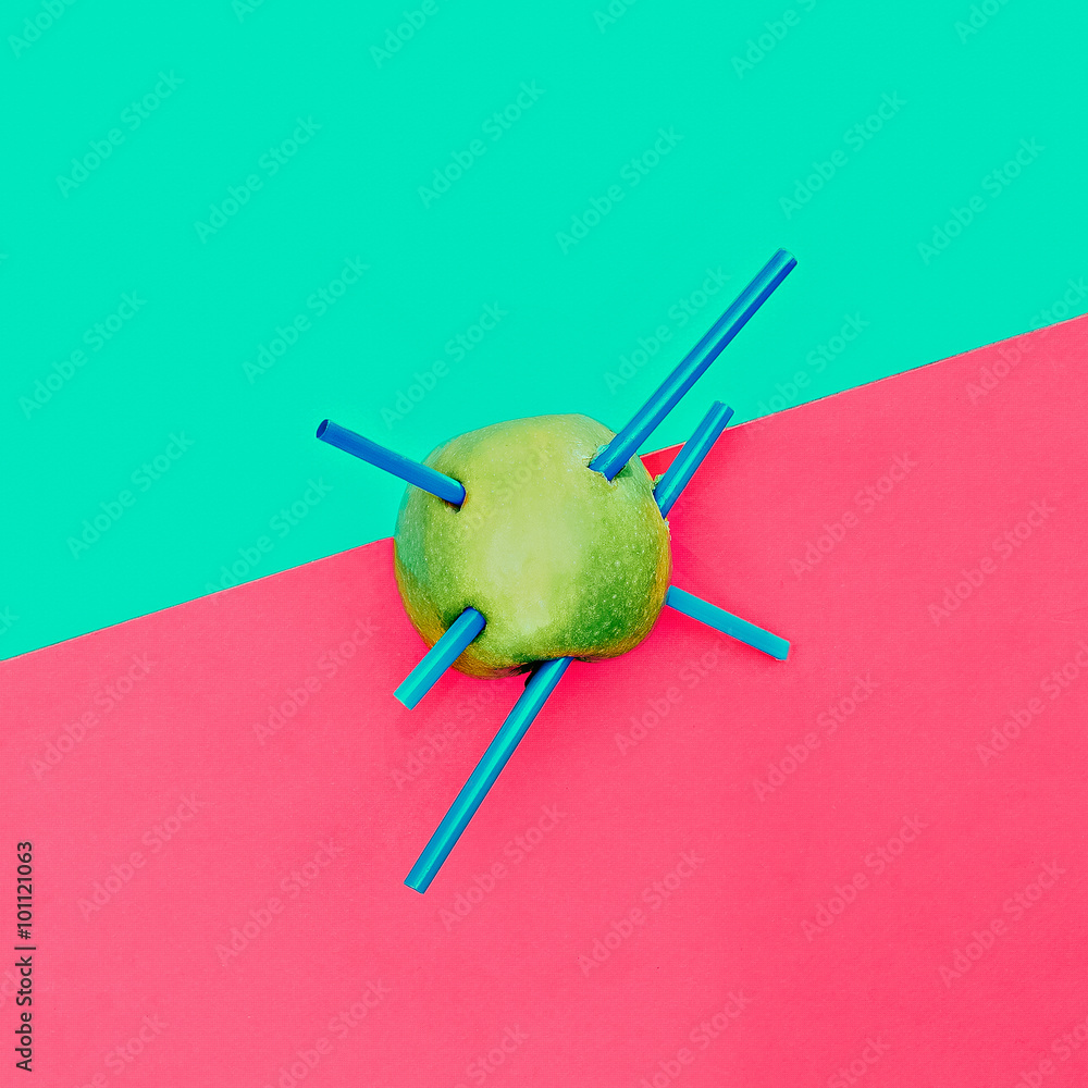 Green apple and plastic tube. Minimalism photo Green apple and plastic tube. Minimalism photo