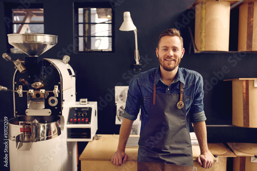 Fotografija Entrepreneur in his modern coffee roastrery and distribution spa