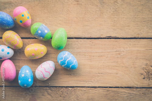 easter eggs on wooden background with space