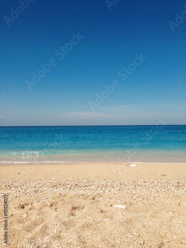 Sandy beach and calm ionian sea