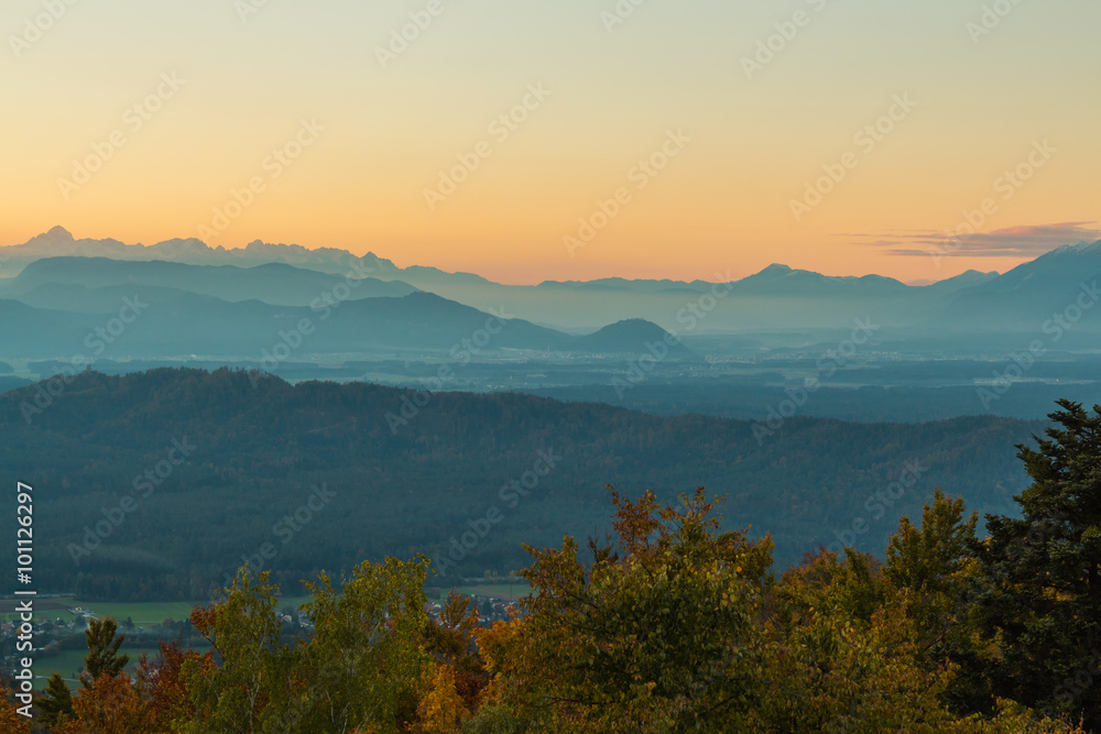 Clean and beautiful sunset above valley with Julian alps on the background.