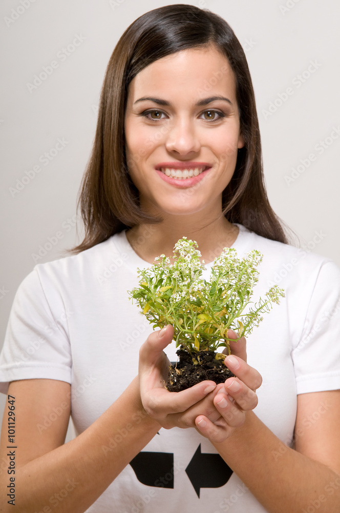 Woman holding a plant Woman holding a plant