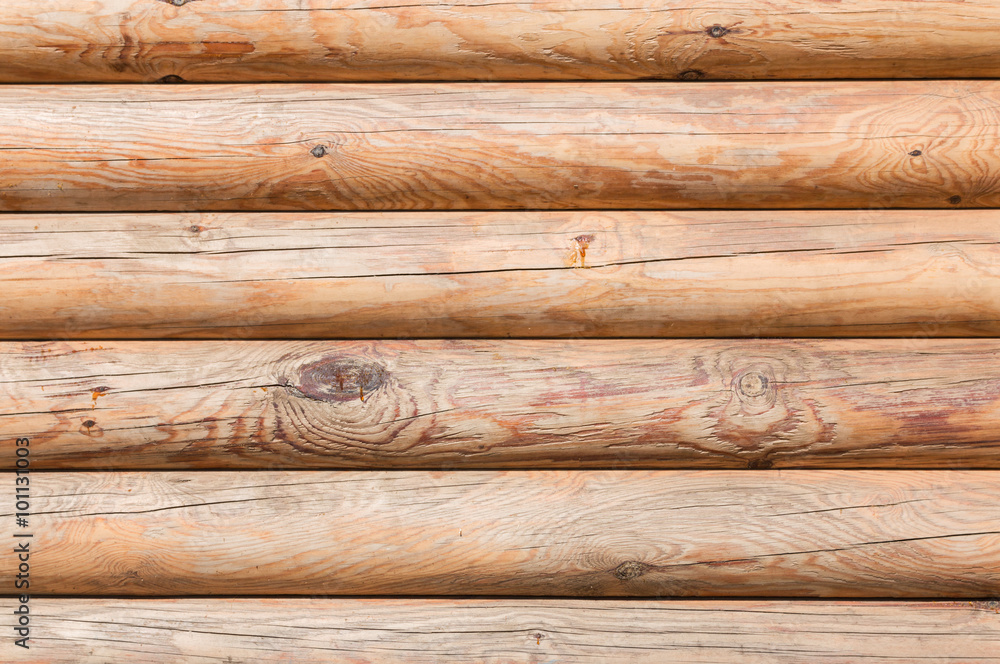 Closeup texture of the walls made of logs in the sun Closeup texture of the walls made of logs in the sun