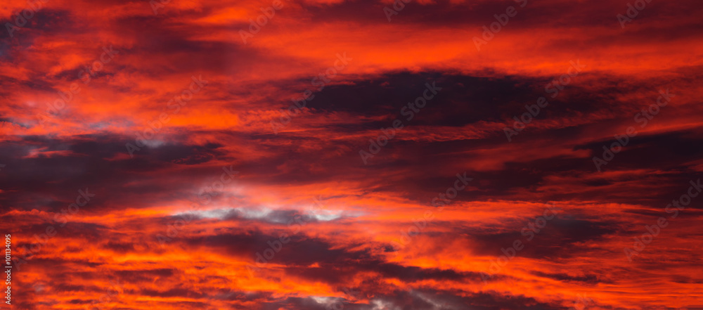 Beautiful orange sunset with dark clouds