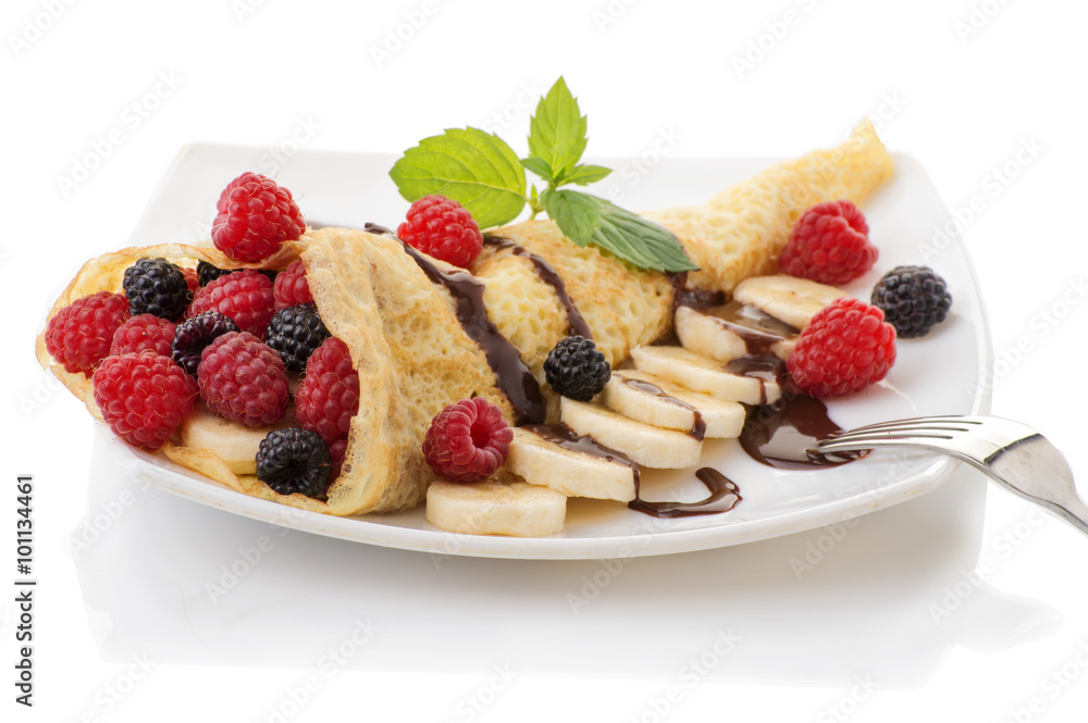 Crepe with Strawberry, Raspberry, Blueberry and Chocolate topping. Pancake Crepe with Strawberry, Raspberry, Blueberry and Chocolate topping. Pancake
