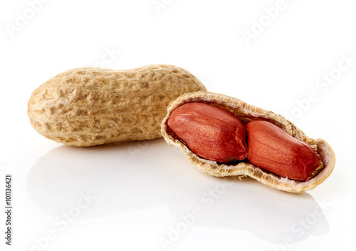 Cracked peanuts on white backround