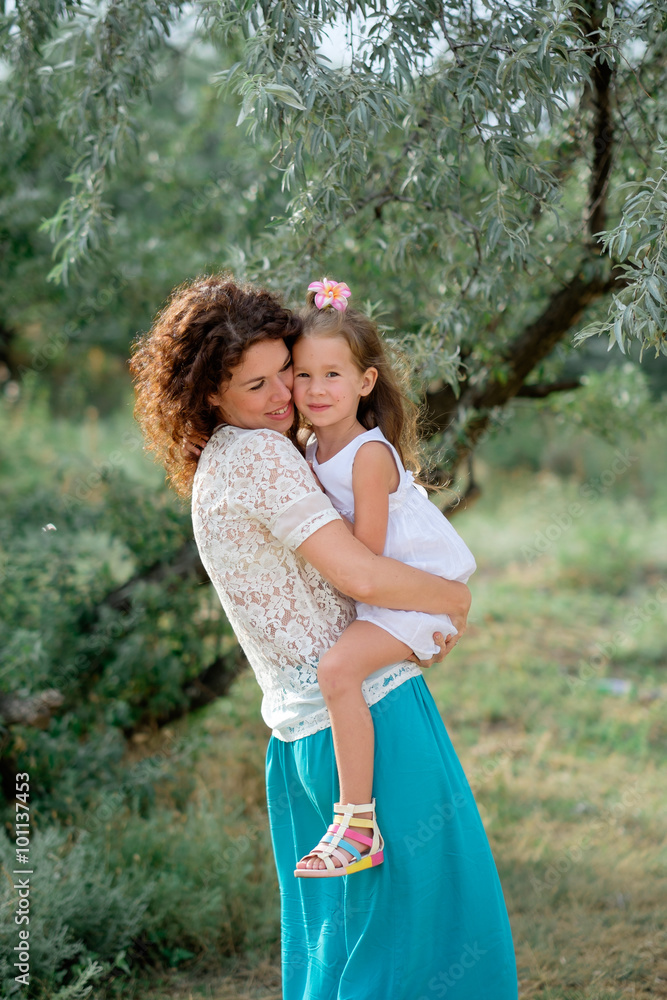 young mother with a baby in nature young mother with a baby in nature