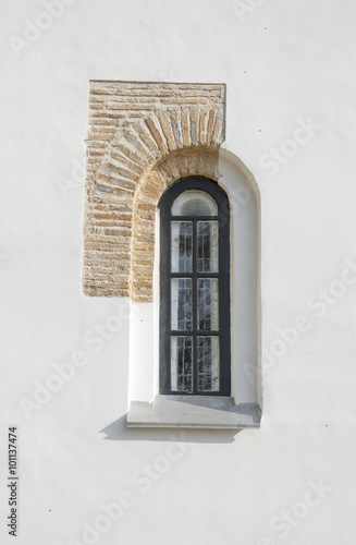 Window of ancient temples and a fragment of masonry walls in Che