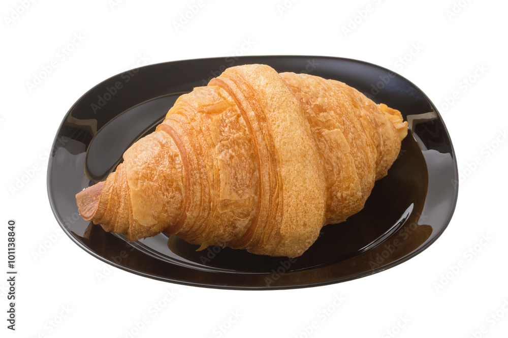 .delicious croissant on a dark plate.