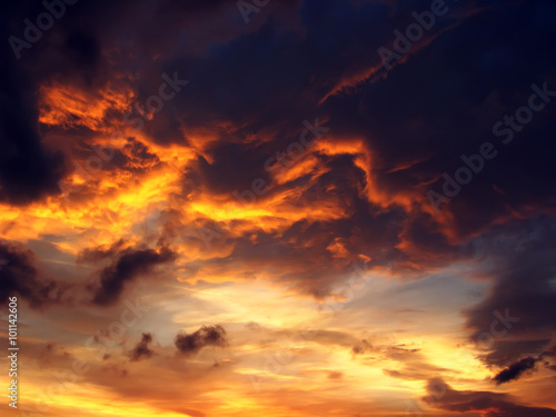 Fototapeta Naklejka Na Ścianę i Meble -  Dramatic sunset like fire in the sky with golden clouds