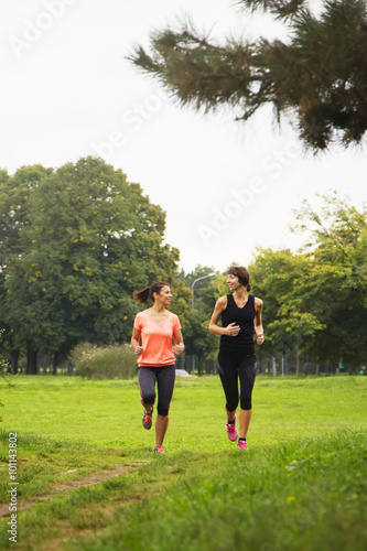 Young women running at park