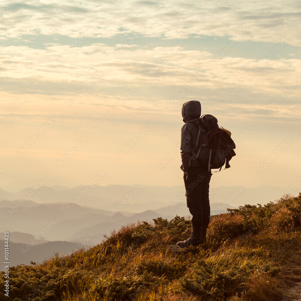 Traveler with backpack and mountain panorama Traveler with backpack and mountain panorama