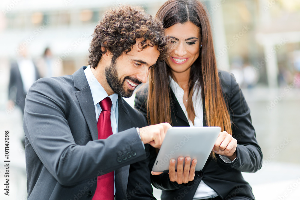 Business people using a digital tablet Business people using a digital tablet