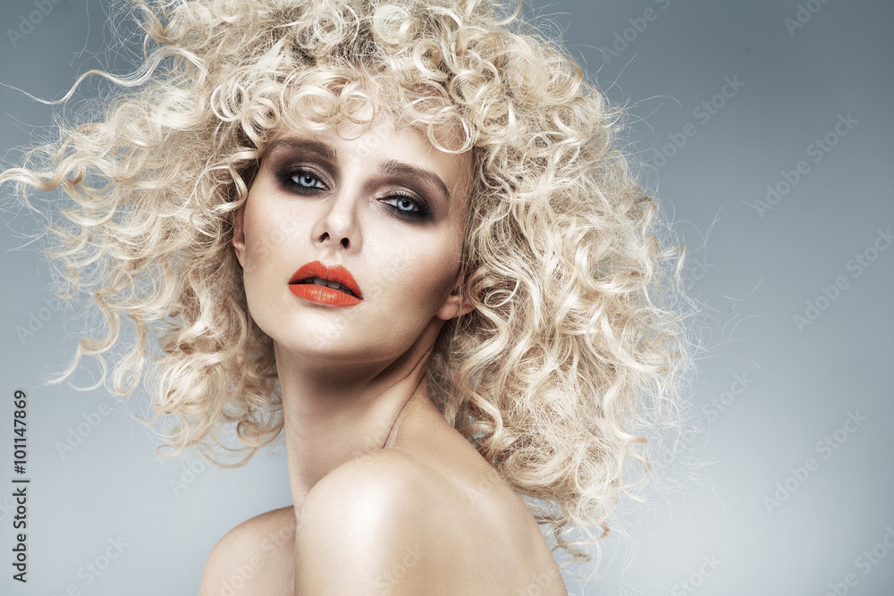 Beautiful blonde with a quaint curly haircut