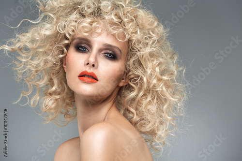Beautiful blond lady with gorgeous curly coiffure
