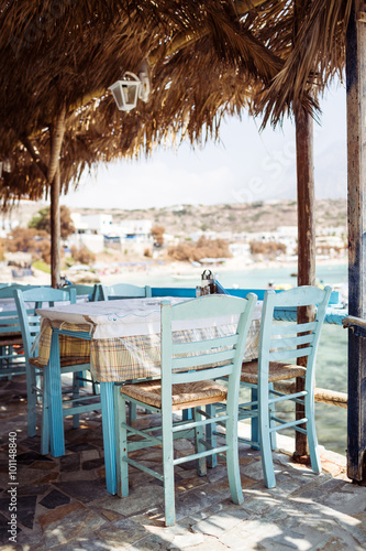 Traditional greek tavern located in a small fishing port. Karpathos island. Greece. Shallow depth of field.