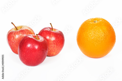 Three red apples and orange