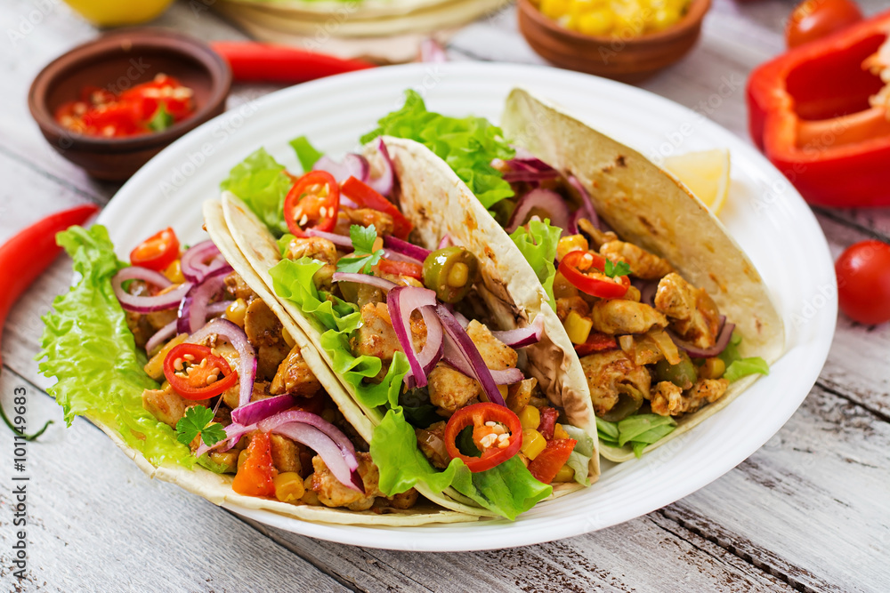 Mexican tacos with meat, corn and olives on wooden background. Mexican tacos with meat, corn and olives on wooden background.
