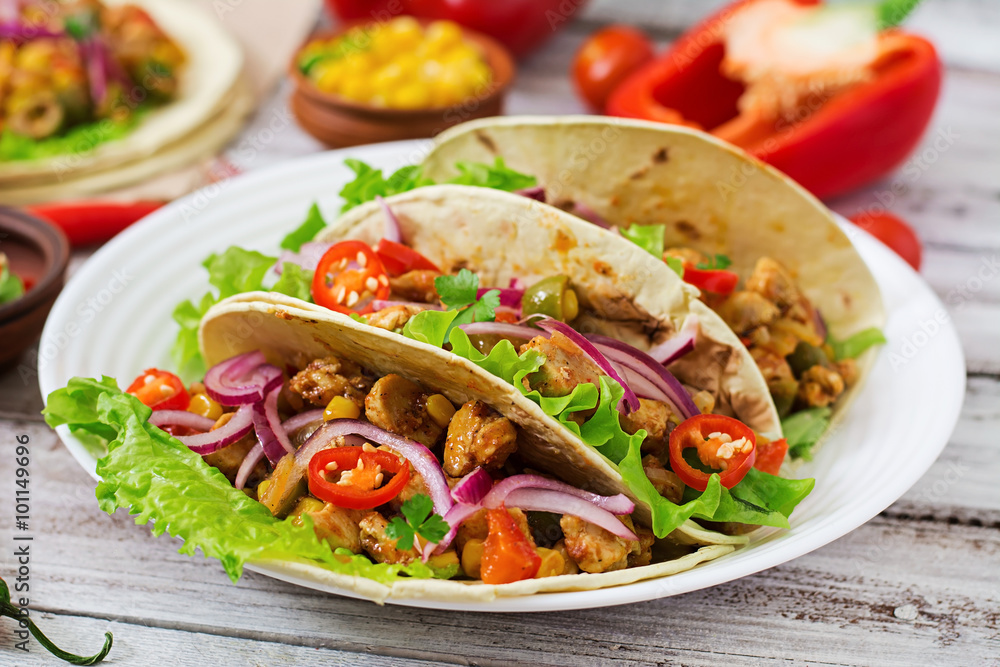 Mexican tacos with meat, corn and olives on wooden background. Mexican tacos with meat, corn and olives on wooden background.