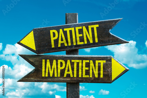Patient - Impatient signpost in a beach background photo