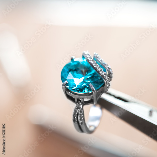 Desktop jeweler. silver ring on the desktop jeweler