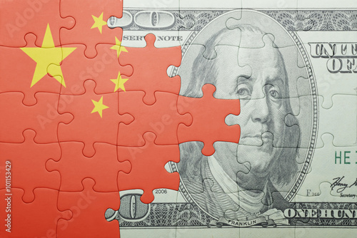 puzzle with the national flag of china and dollar banknote