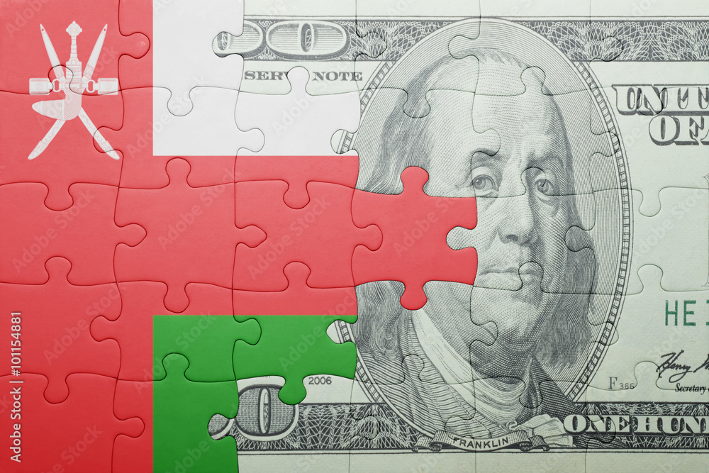 puzzle with the national flag of oman and dollar banknote puzzle with the national flag of oman and dollar banknote