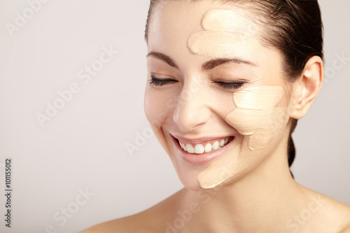 Obraz na plátně Beautiful face of woman with cosmetic foundation on skin