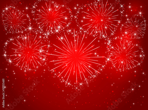 Firework with hearts on red background © losw100