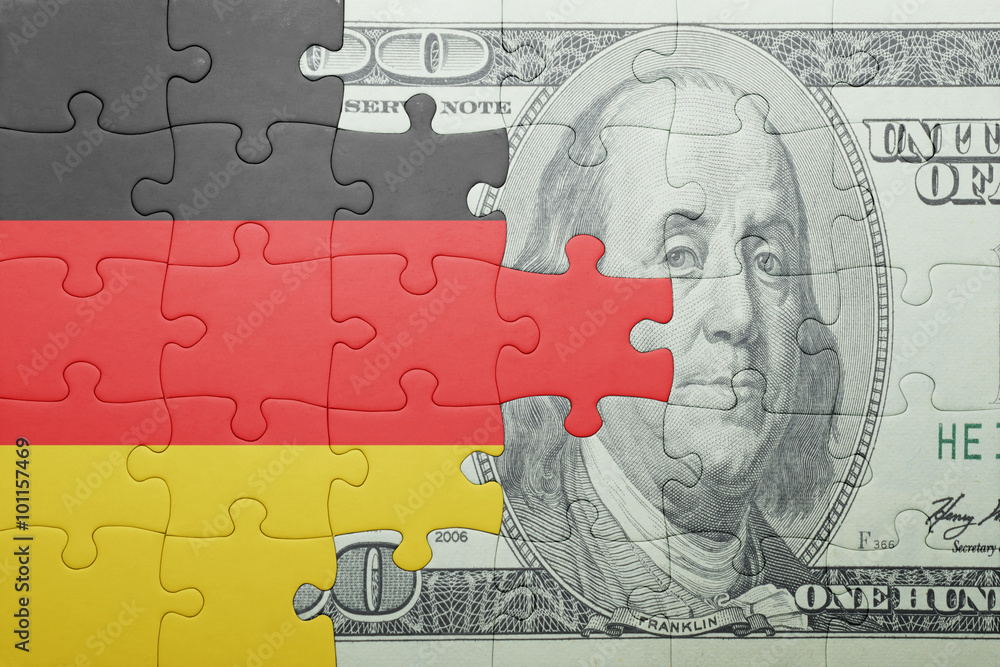 puzzle with the national flag of germany and dollar banknote