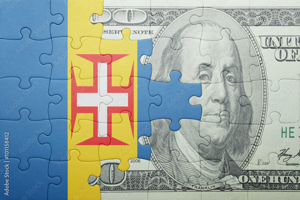 puzzle with the national flag of madeira and dollar banknote