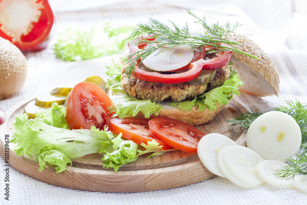 Homemade hamburger, vegetables and herbs.
Homemade hamburger, sliced tomatoes, onion, pepper, lettuce and dill on wooden board. Homemade hamburger, vegetables and herbs.
Homemade hamburger, sliced tomatoes, onion, pepper, lettuce and dill on wooden board.