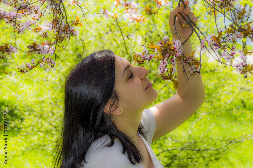 Beautiful woman smells flowers Beautiful woman smells flowers