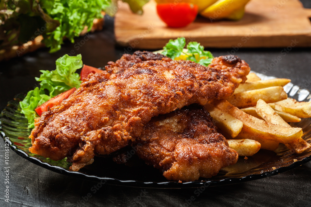 Fried fish in crispy batter with chips